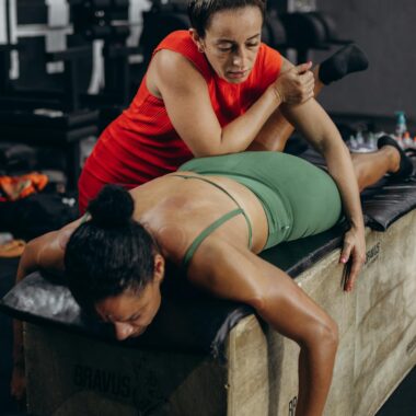 A woman doing a leg exercise with a trainer